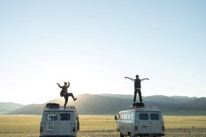 Bucket list captions photo of friends on top of VW vans.