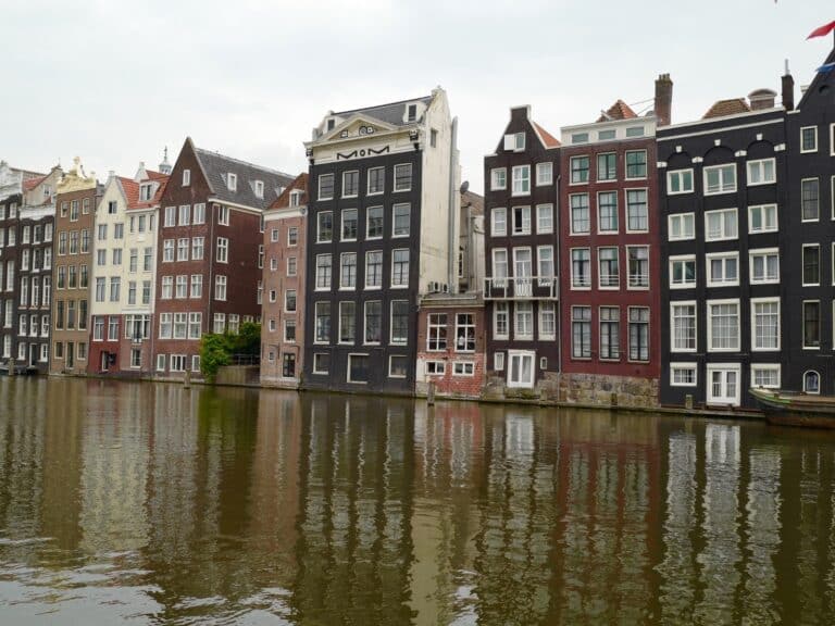 Layover in Amsterdam photo of the gingerbread homes by the canals in Amsterdam.