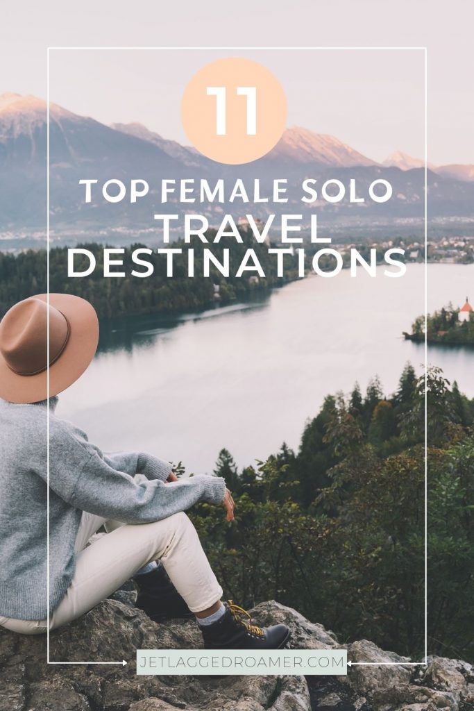 Woman sitting on a mountain overlooking a river. Text says 11 top female solo travel destinations.