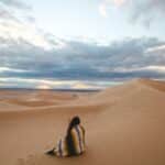 Best places for solo female travel photo of a woman alone in a desert.