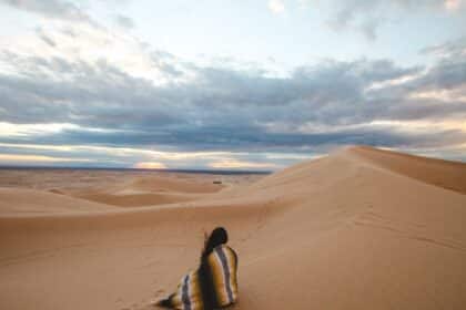 Best places for solo female travel photo of a woman alone in a desert.