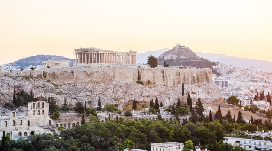 Things to do in Athens photo of the Acropolis during sunset.