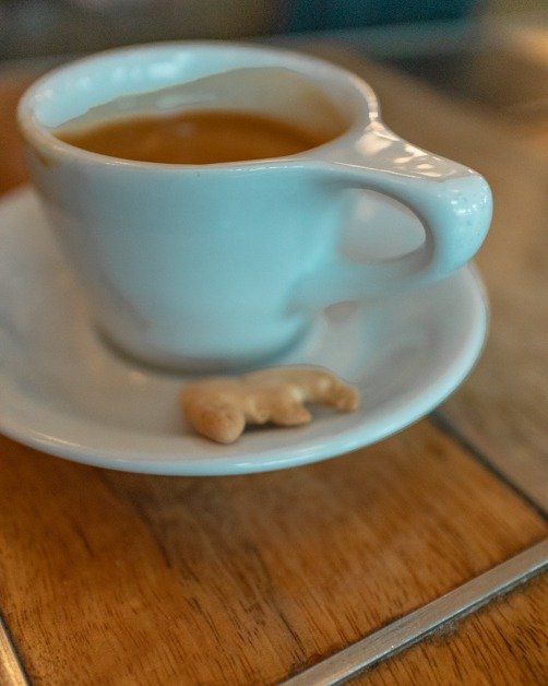 espresso at Halcyon with an animal cracker
