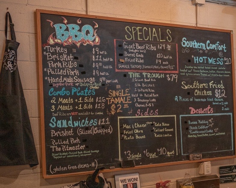 Chalkboard menu hanging at Pecan Lodge