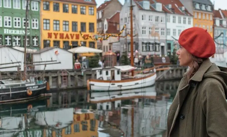 Me at the Nyhavn Canal painted houses one of the best places for solo female travel.