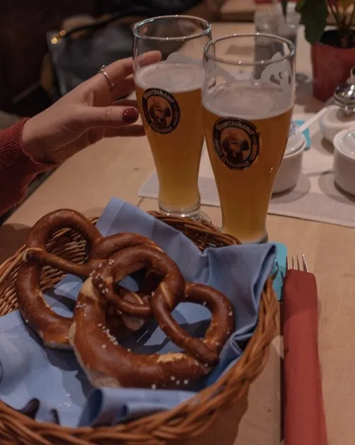 Reaching for pretzels at a Bavarian restaurant in Munich