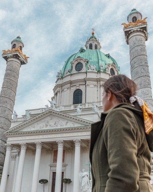 Me at KARLSKIRCHE one of the top places to see spending one day in Vienna.