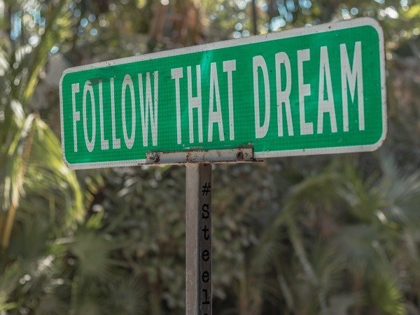 Famous follow that dream sign one of the top things to do in Tulum walking the beach strip.