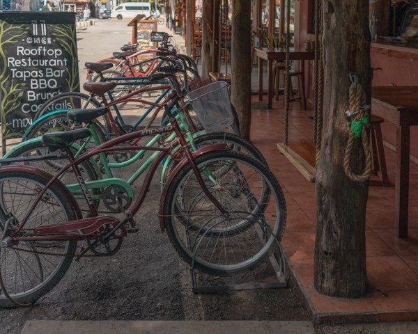 Bicycles aligned outside of a cafe in Tulum town. 