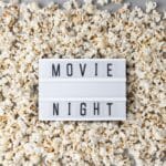 Travel movies photo of popcorn and sign that says movie night.
