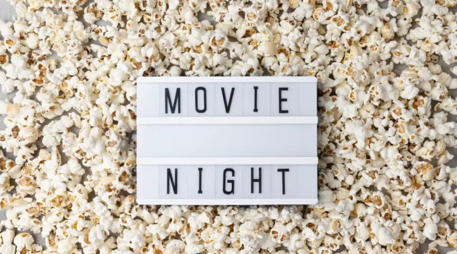 Travel movies photo of popcorn and sign that says movie night.