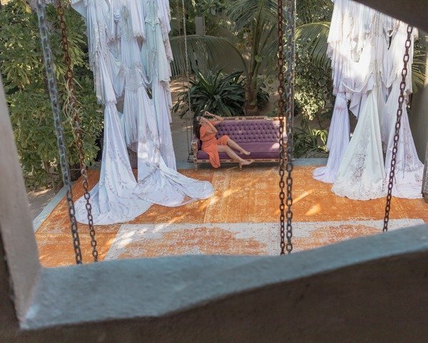 aerial view of me posing on a sofa at Casa Malca one of the top Tulum Instagram spots