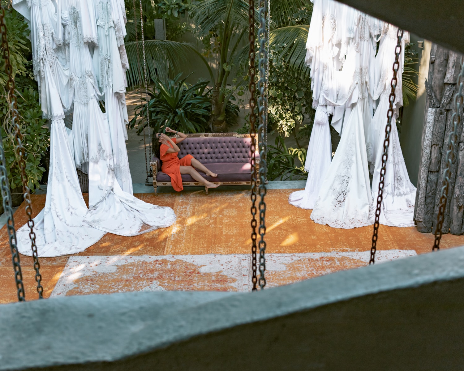 Aerial view of me posing on a sofa at Casa Malca one of the top Tulum Instagram spots