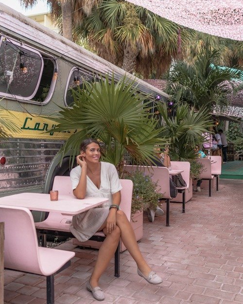 Posing at one of the pink diner tables at Case Florida Miami