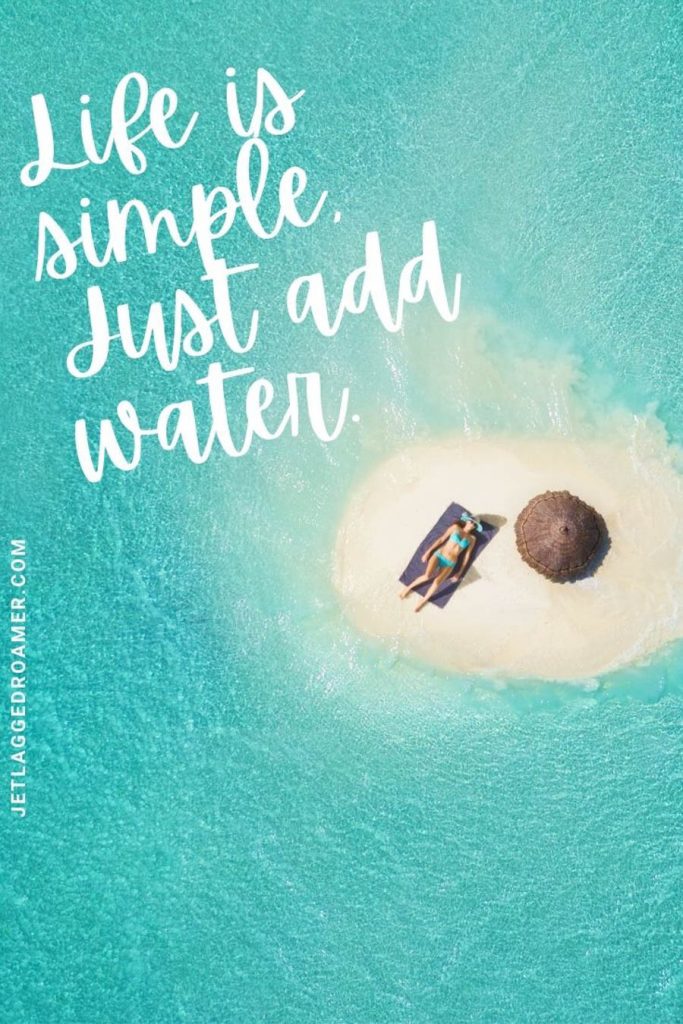 Lady in her bikini laying on a towel and a mini island with a straw umbrella in the middle. of the ocean and a beach life quote that says "life is simple, just add water."