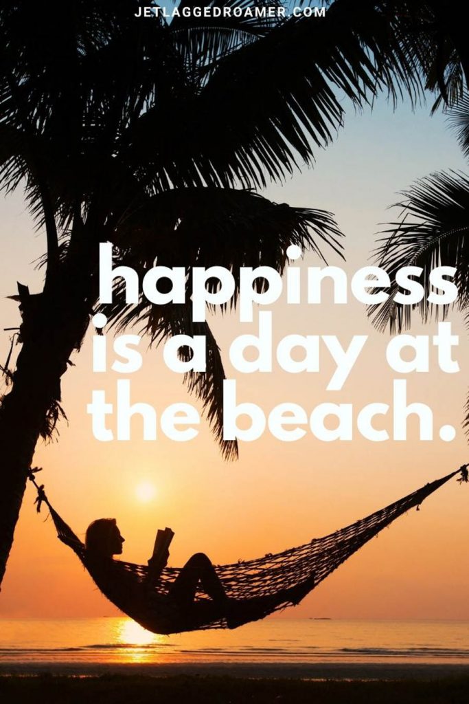 Lady reading on book in a hammock on a tropical island during sunset with a beach vacation quote "happiness is a day at the beach."