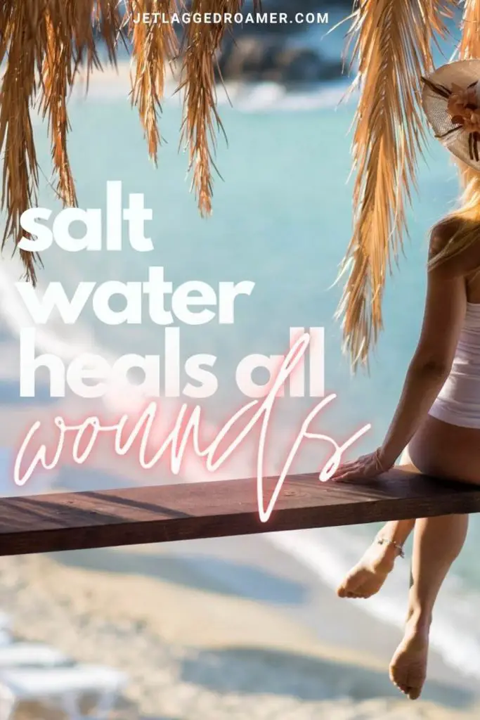Lady in bikini sitting on a plank overlooking the shoreline and a Instagram caption that reads "salt water heals all wounds."