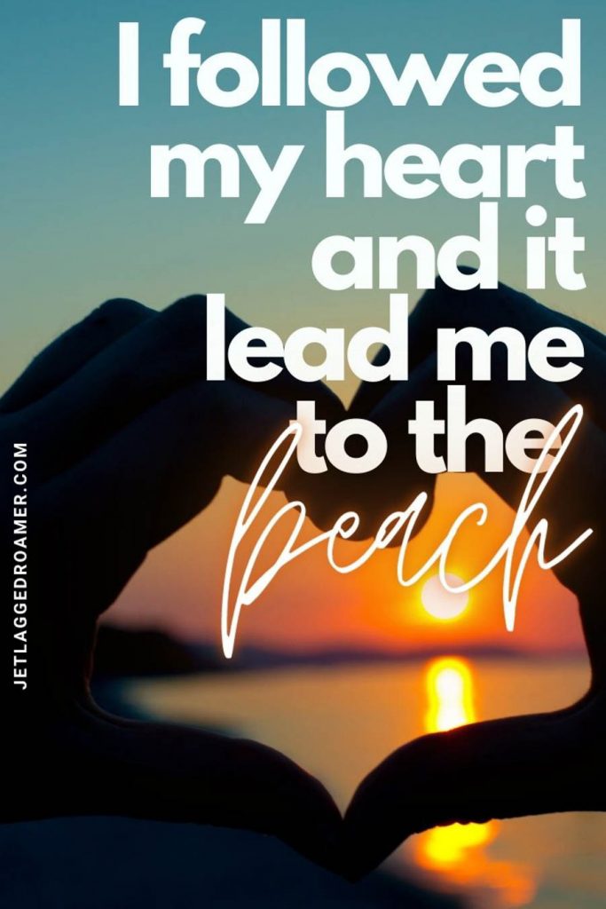 Hands making the shape of a heart and while a sun setting inside with a quote saying "my heart led me to the beach. "