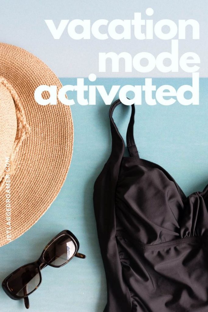 Black swimsuit next to a straw hat and sunglasses with the quote "vacation mode activated."