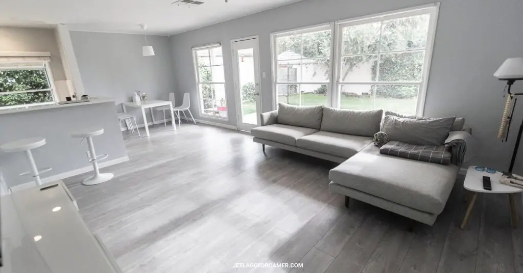 White and grey themed modern living room at an Airbnb with 