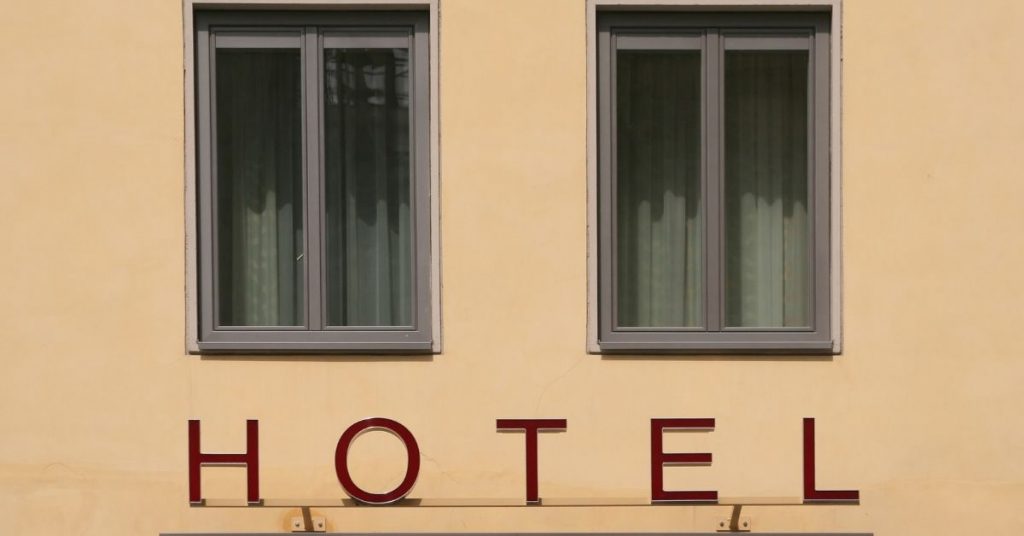 Hotel sign that says hotel in capital letters.