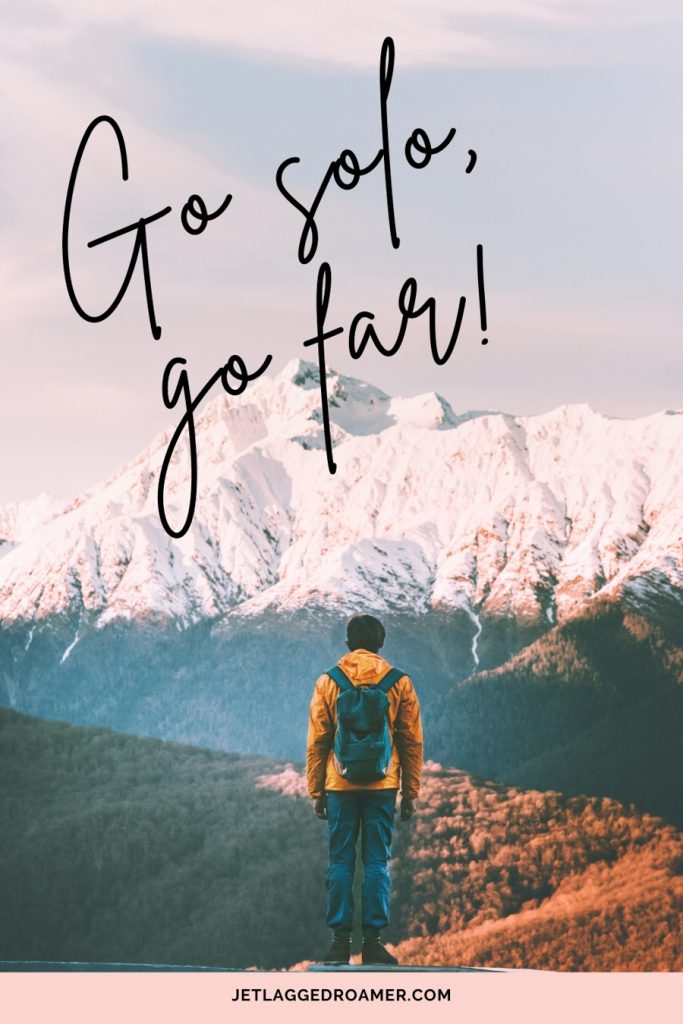 Man overlooking the mountains with a traveling alone quote saying “Go solo, go far.” 