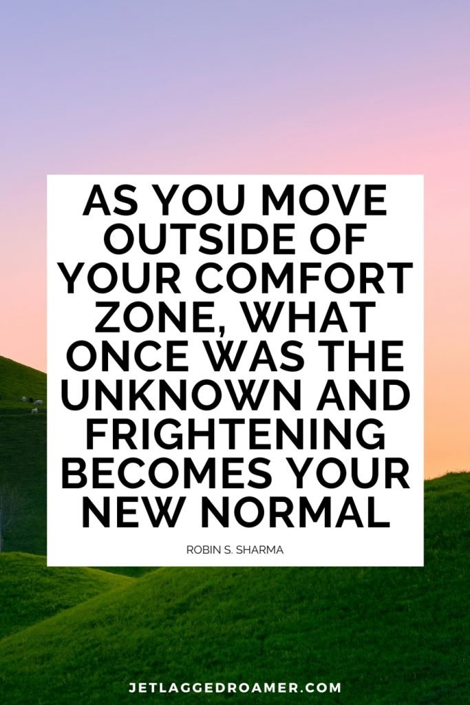 Image of an empty plain during dusk. Travel alone quote reads “As you move outside of your comfort zone, what once was the unknown and frightening becomes your new normal