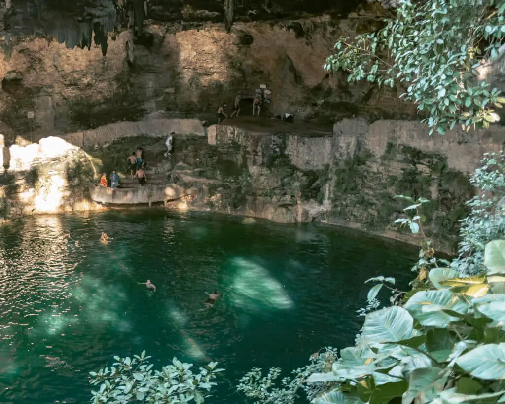 People swimming in Cenote Zaci on a sunny day one of the best things to do in Valladolid. 