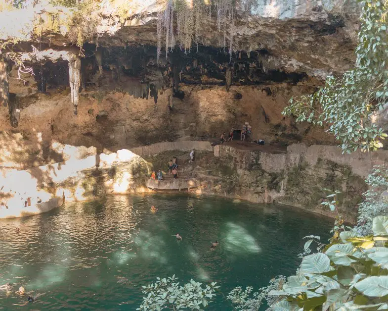 People swimming in Cenote Zaci on a sunny day one of the best things to do in Valladolid. 
