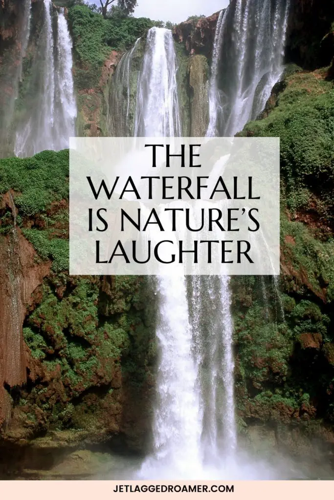 waterfall streaming through a forrest. Waterfall saying reads “The waterfall is nature’s laughter” 