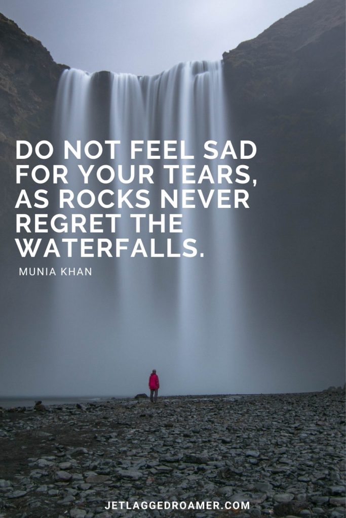 Man standing in front of a massive waterfall and the text is an inspiring waterfall quote that reads “Do not feel sad for your tears, as rocks never regret the waterfalls.”