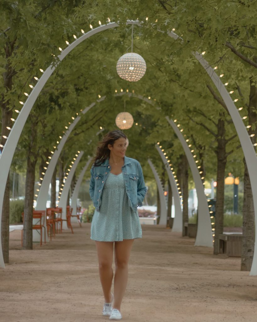 Me posing under the archways at Klyde Warren Park one of the best places to take pictures in Dallas. 