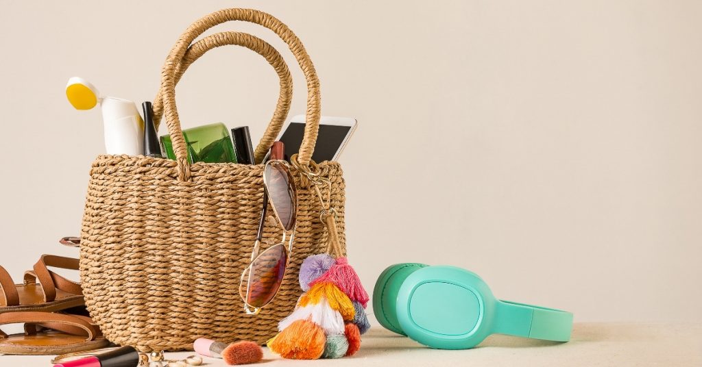 Straw beach bag with essentials to pack for the beaches in Florida