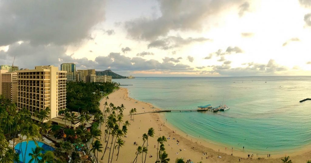 Hawaii captions picture of Waikiki beach during sunset. 