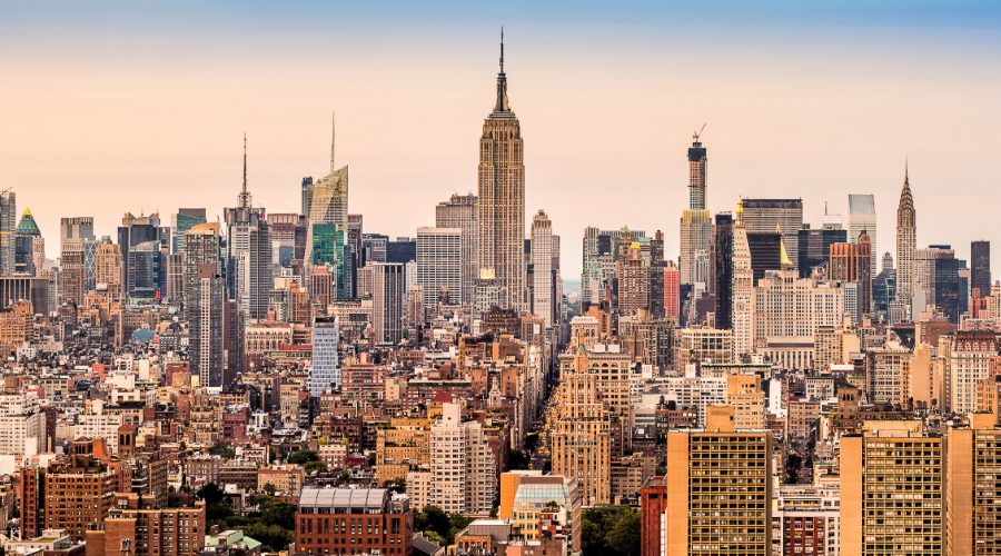 New York Instagram captions photo of an aerial view of NYC during sunset.