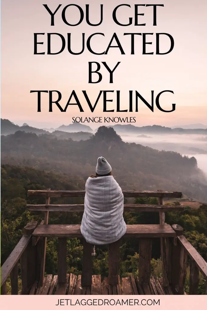 Travel caption for Instagram that says you get educated by traveling. Woman wrapped in a blanket alone staring at the mountains.
