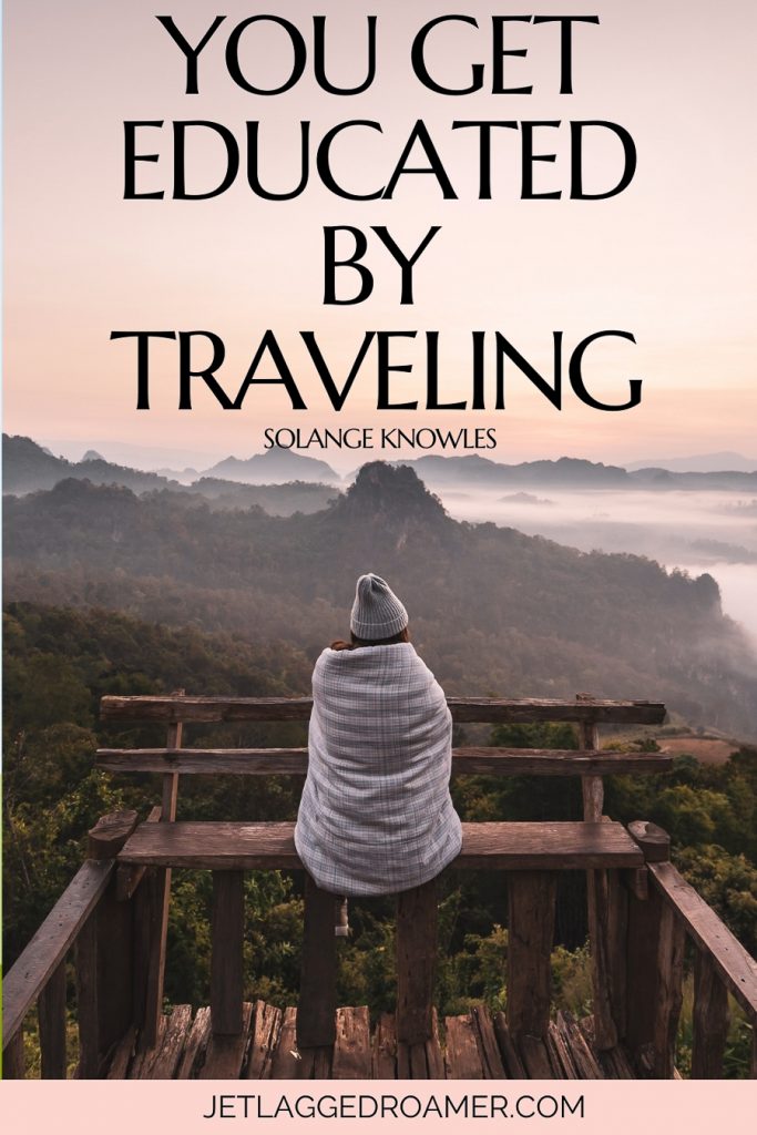 Travel caption for Instagram that says you get educated by traveling. Woman wrapped in a blanket alone staring at the mountains.