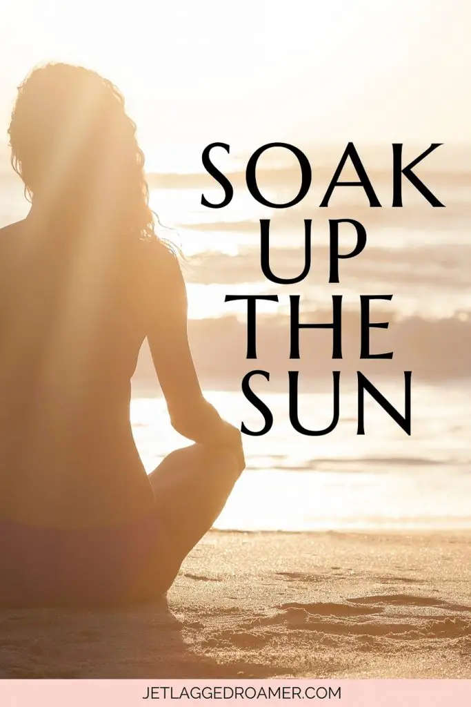 Sun caption for Instagram that says they got the sun. Silhouette of a woman sitting at the beach during sunrise.