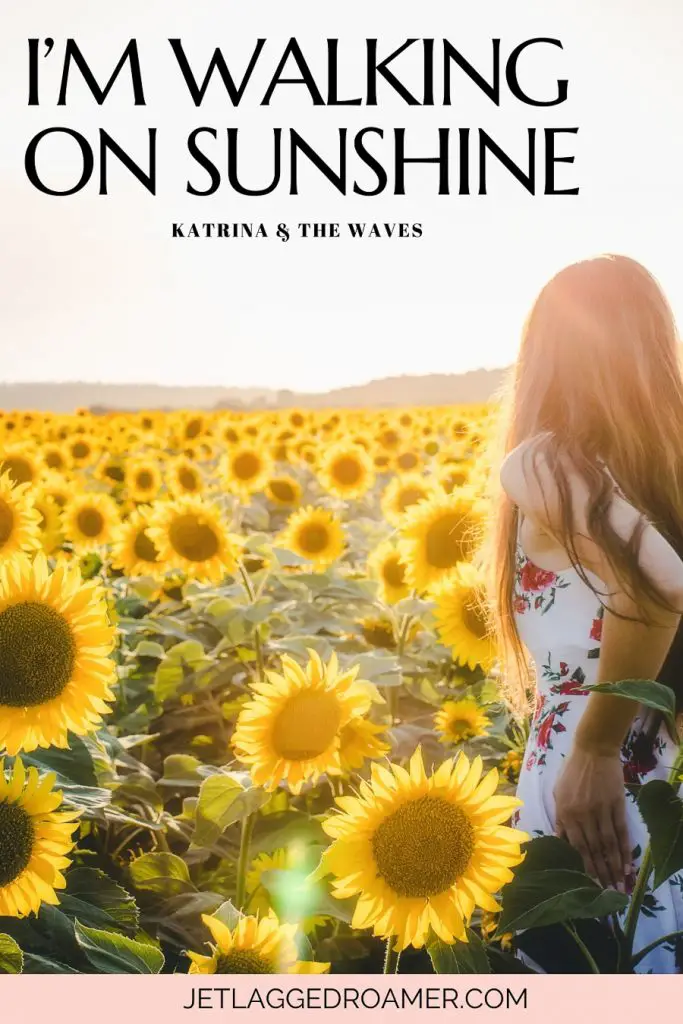 Sun captions music lyric that says I'm walking on sunshine by Katrina and the waves. Woman in a sunflower field on a sunny day.