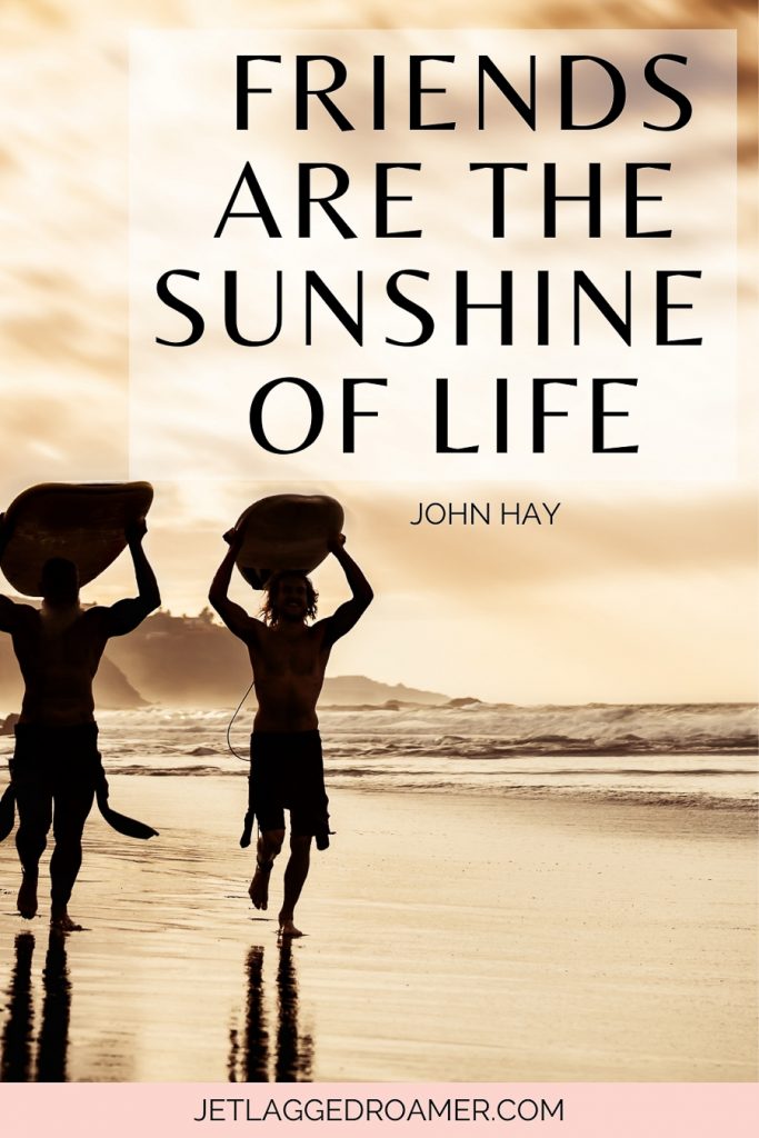 Sunshine quote for Instagram that says friends are the sunshine of life. Two friends holding surfboards on their hands during sunrise.