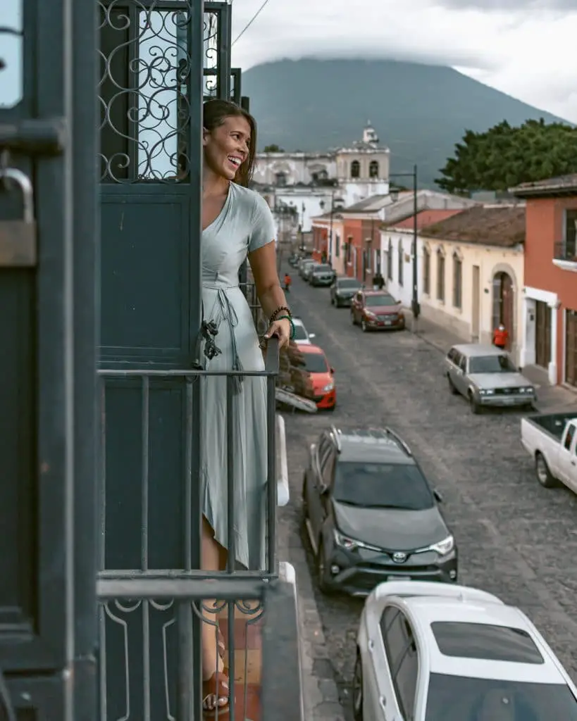 me posing on the balcony at Cafe Sky the best Antigua, Guatemala photo spot.