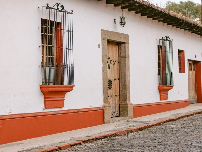 Orange and white building on the streets of Antigua, Guatemala. 