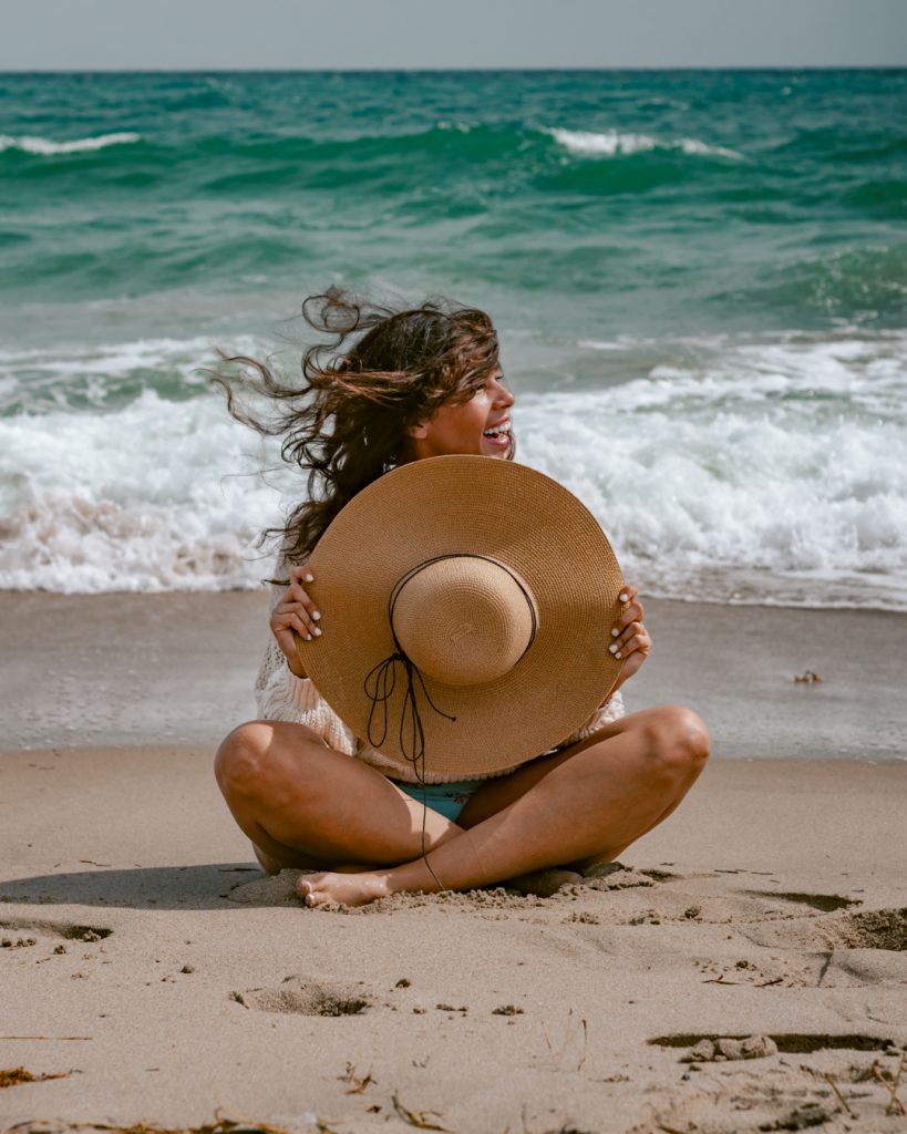 Me sitting and posing by  the ocean in South Beach