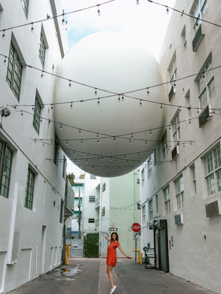 Posing under The Egg one of the most unique places to take pictures in Miami. 