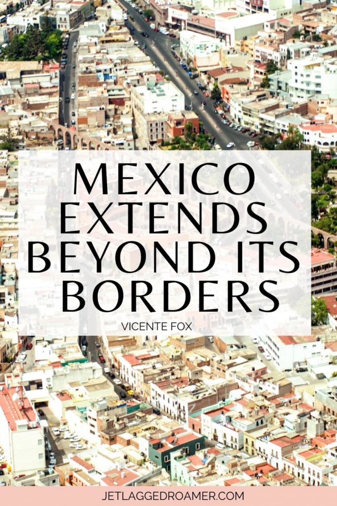 Mexican quote that says “Mexico extends beyond its borders.” Aerial view of Mexico City. 