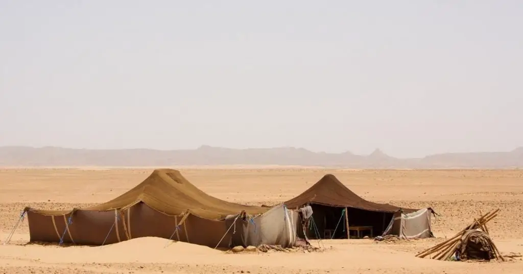 Desert safari captions photo of tents in the African desert. 