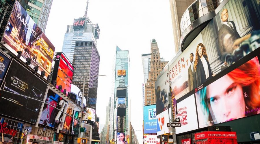 Times Square captions photo of Times Square in New York City.