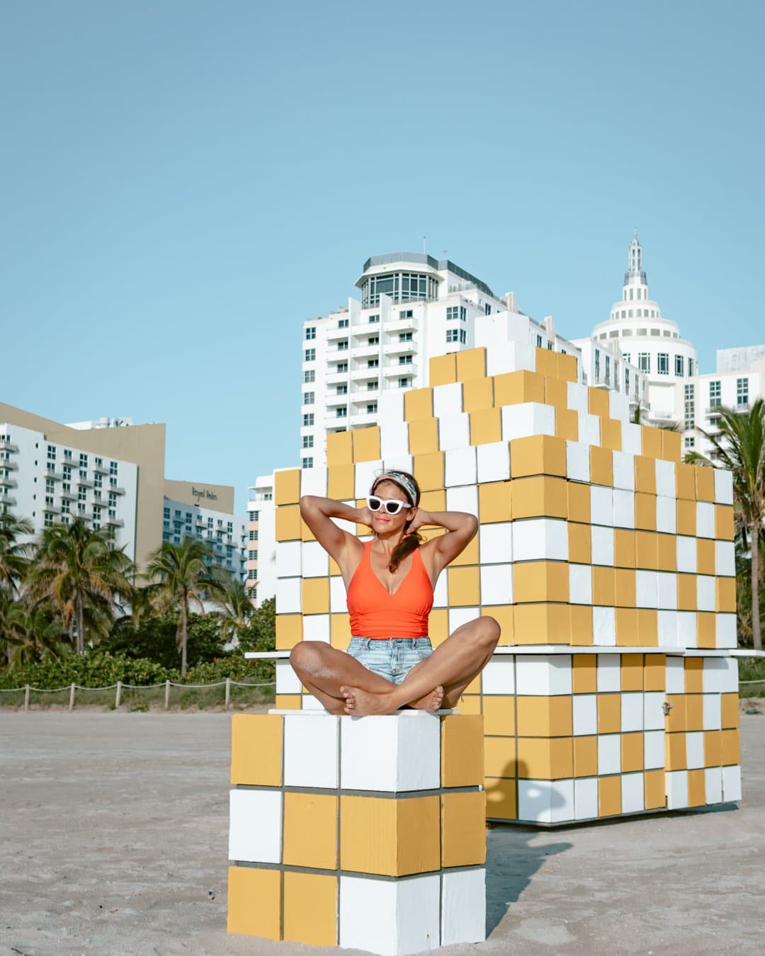 Posing at a checkered lifeguard tower in Miami South Beach. 