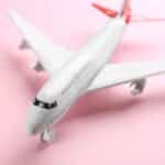 Idioms about travel photo of a toy airplane.