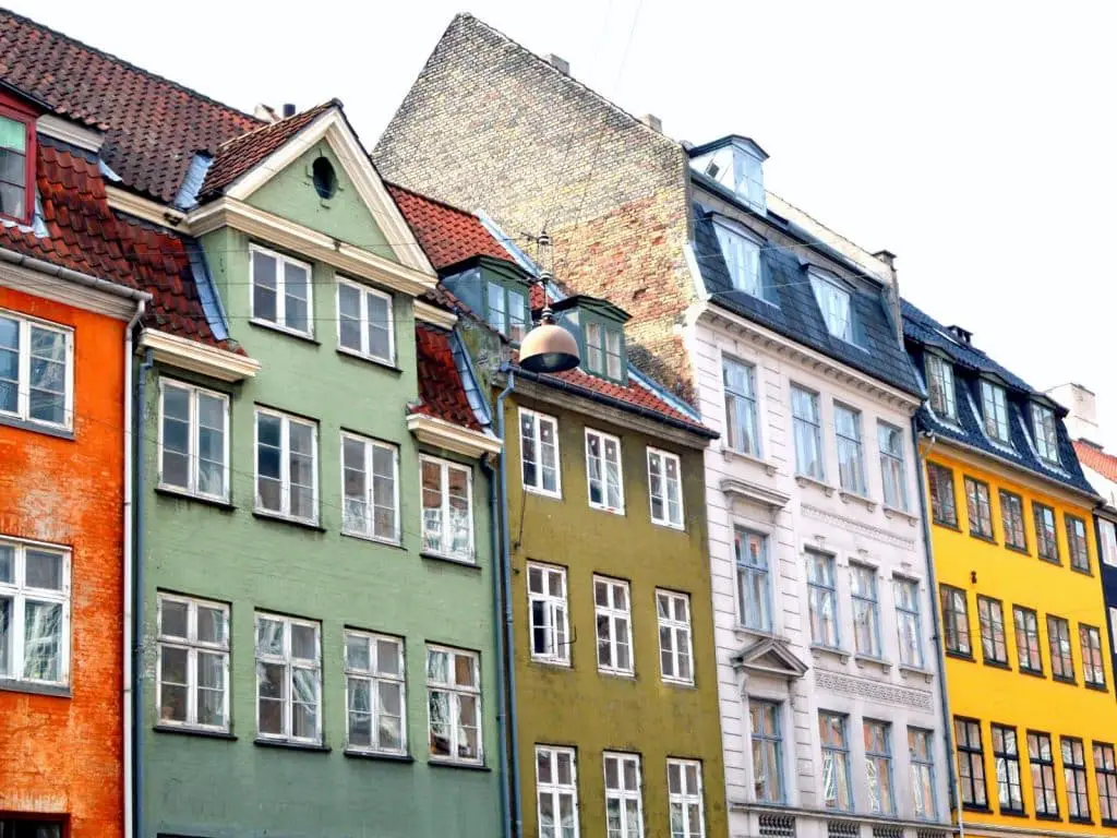 Copenhagen quotes photo of colorful buildings along Nyhavn Canal in Copenhagen, Denmark. 